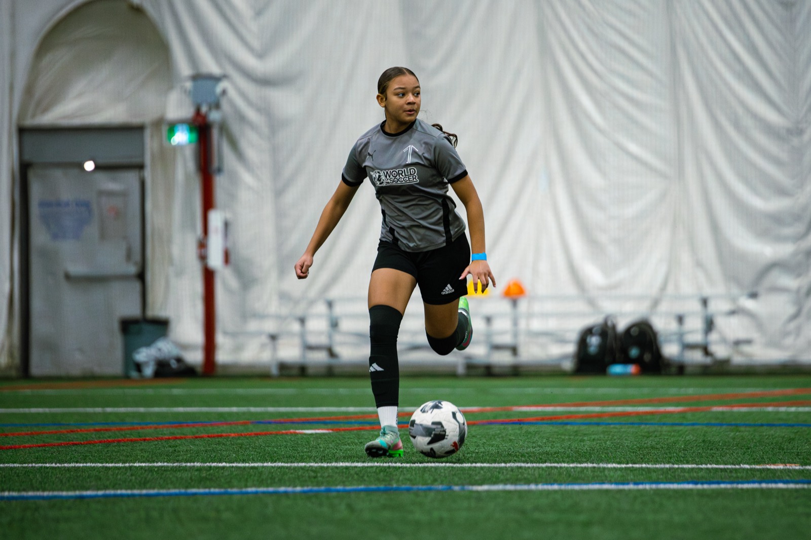 1UP players working on their position in a camp session